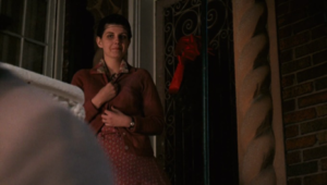 Clemenza's wife looks approvingly at him